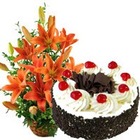 Cakes Delivery in Jammu. 12 Orange Lily Arrangement 1 Kg Black Forest Cake to Jammu